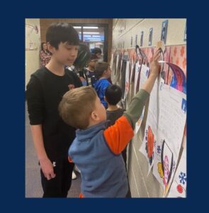 an older student listening to a younger student share his story